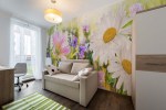 Op maat gemaakt fotobehang bloemenveld bij zonsondergang